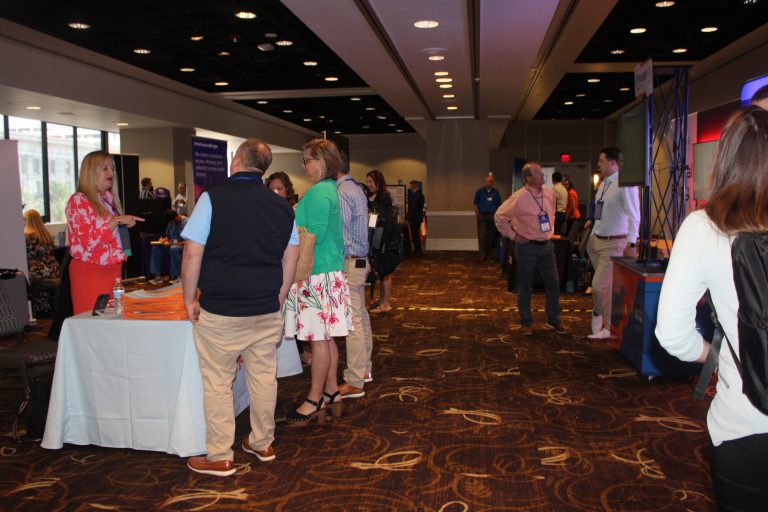 Attendees Browse the Exhibit Hall