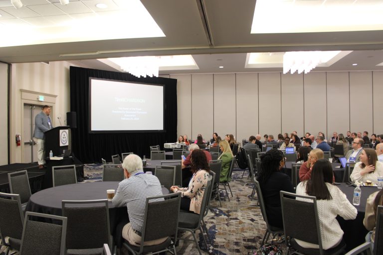 Speaker delivers presentation to audience